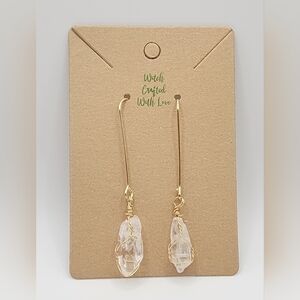 Gold plated drop earrings with wire wrapped quartz crystal.